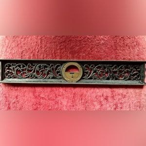 Antique scrolled level from Davis Level Tool Company. Cast iron and brass